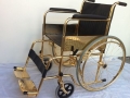 Silla de ruedas en oro